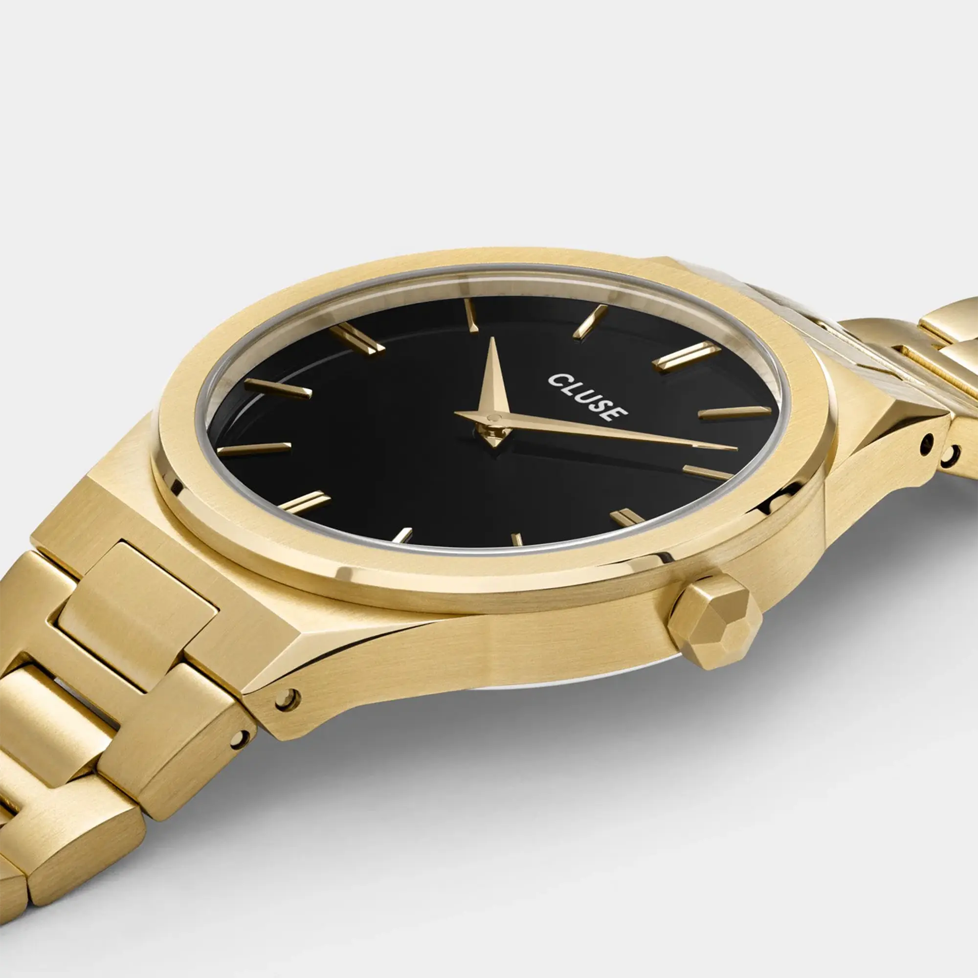 Detailansicht des Gehäuses der goldfarbenen Cluse Damenuhr Vigoureux CW101210007 mit schwarzem Zifferblatt und am Gehäuse integrierten, goldfarbenem Armband