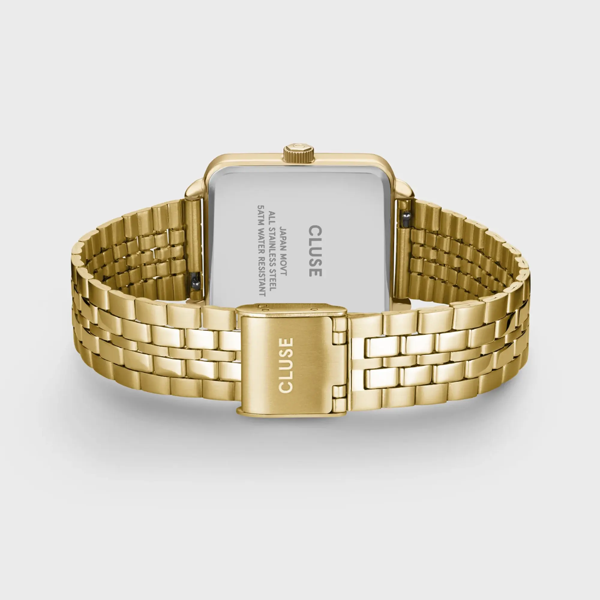 Blick auf das Band und den Gehäuseboden der goldfarbenen Cluse Damenuhr La Tetragone Multifunction CW13804 mit weißem Zifferblatt in quadratischem Uhrengehäuse an einem goldfarbenem Edelstahl-Armband