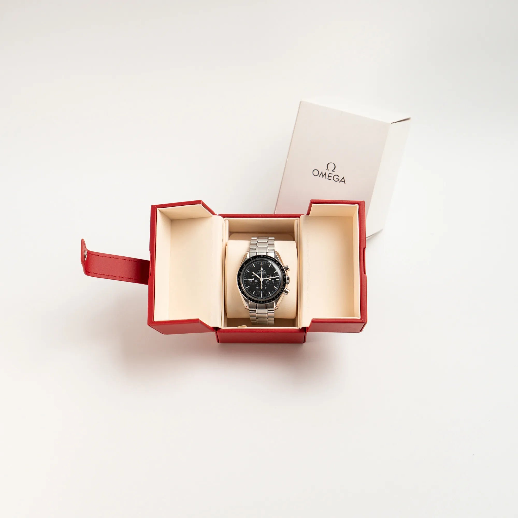 Omega Speedmaster Professional Moonwatch mit Hesalitglas zusammen mit dem Lieferumfang bestehendf aus Uhr und Travelbox