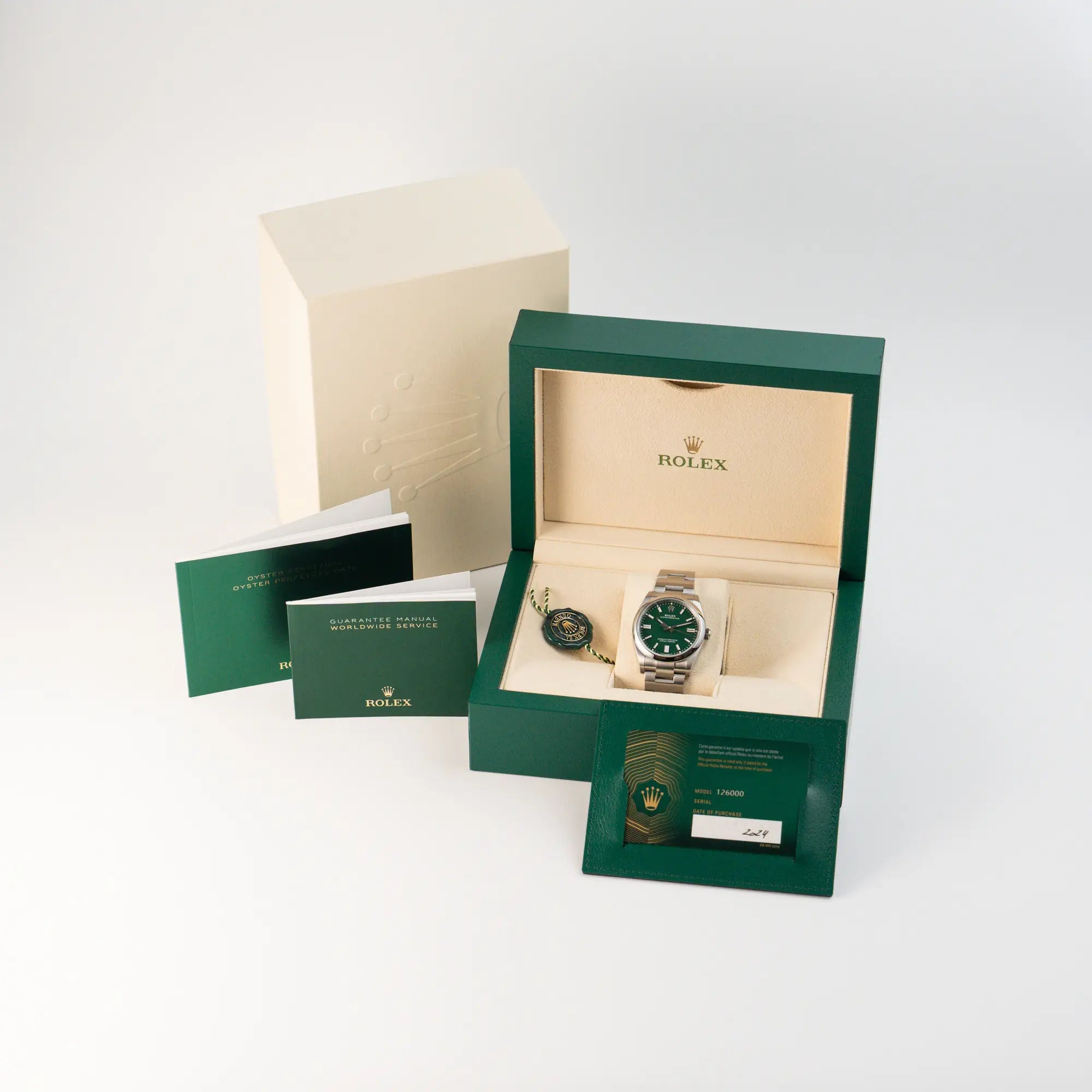 Lieferumfang für die Rolex Oyster Perpetual in 36mm mit dem grünen Zifferblatt als Full-Set