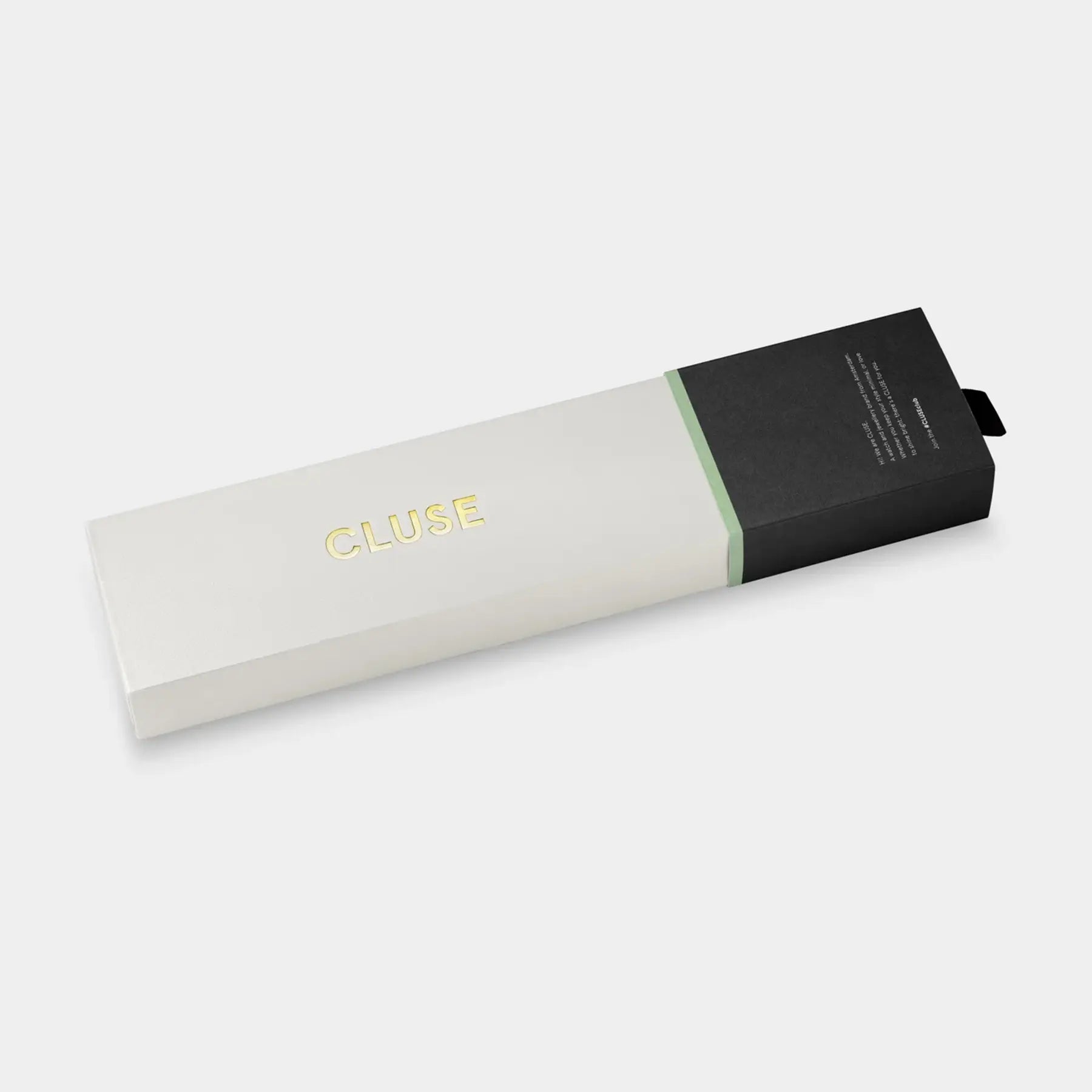Verpackung der der goldfarbenen Cluse Damenuhr Gracieuse Petite der Referenz CW11815 mit weißem Zifferblatt an einem feingliedrigen goldfarbenem Armband