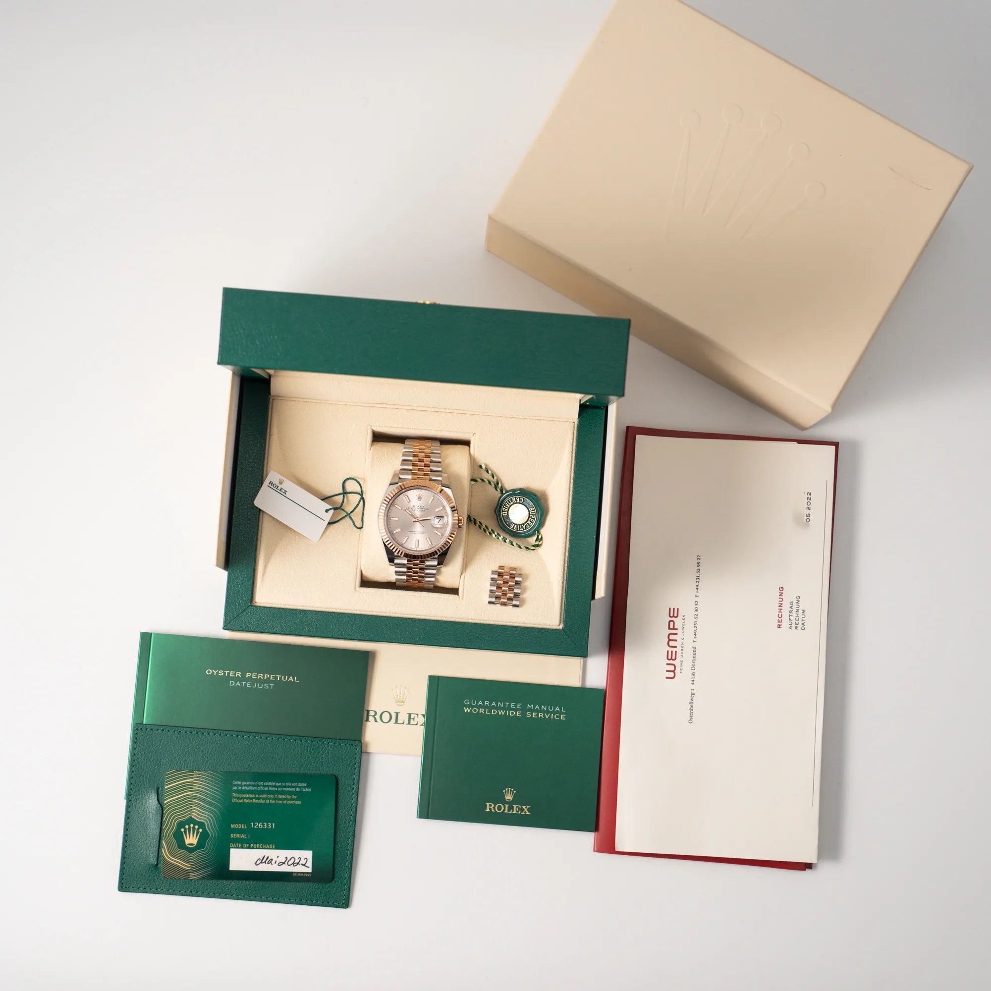 Rolex Datejust 41 in Stahl-Roségold mit am passenden Jubilee-Armband mit dem pink-lachsfarbenen "Sundust" Zifferblatt zusammen mit dem Lieferumfang, bestehend aus Box mit Umkarton, Papieren, Booklets, Hangtags, sowie dem Wempe-Erstkaufbeleg