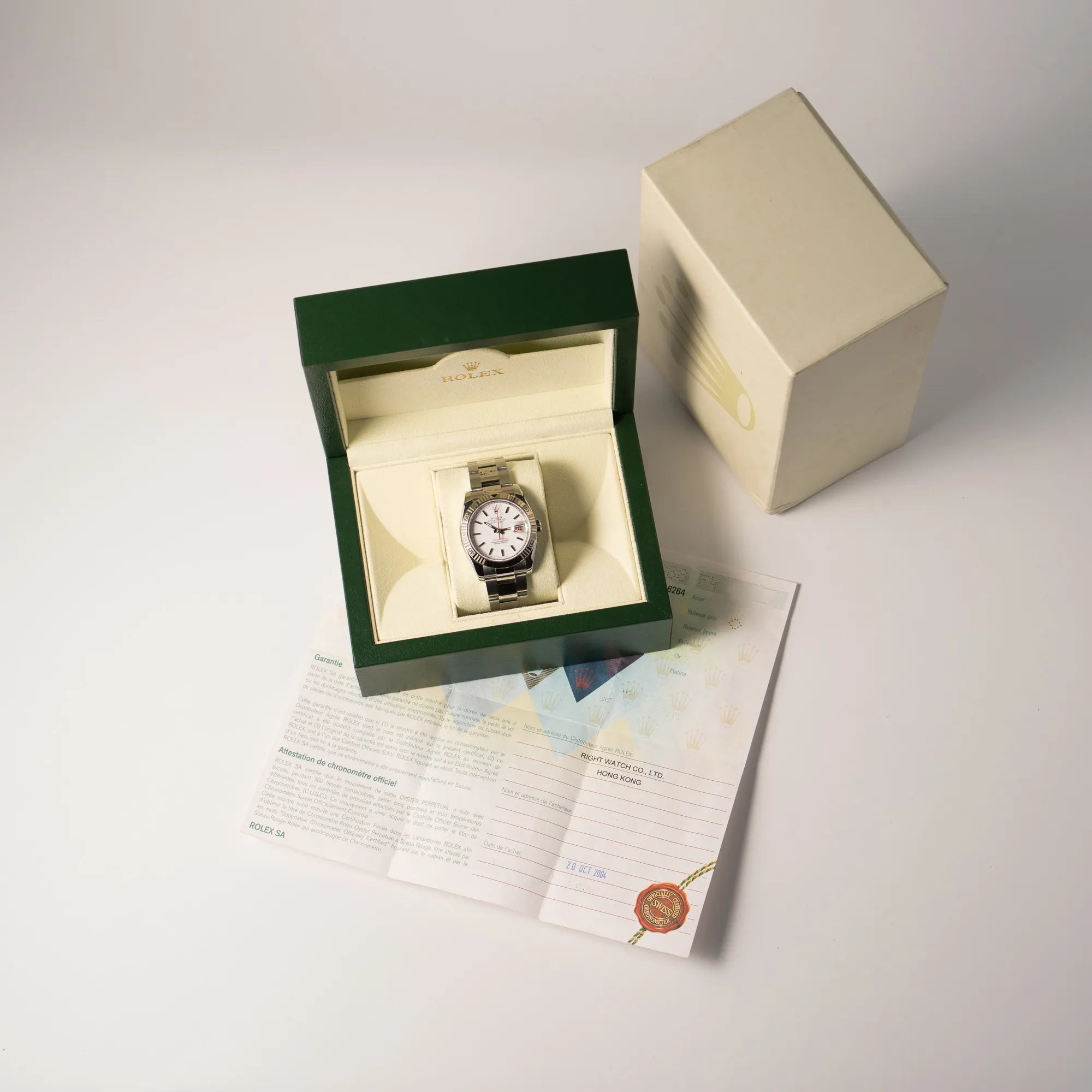 Rolex  Datejust Turn-O-Graph 116264 in 36 mm mit dem weißen Zifferblatt und dem roten Sekundenzeiger  zusammen mit dem Lieferumfang, bestehend aus Box und Papieren