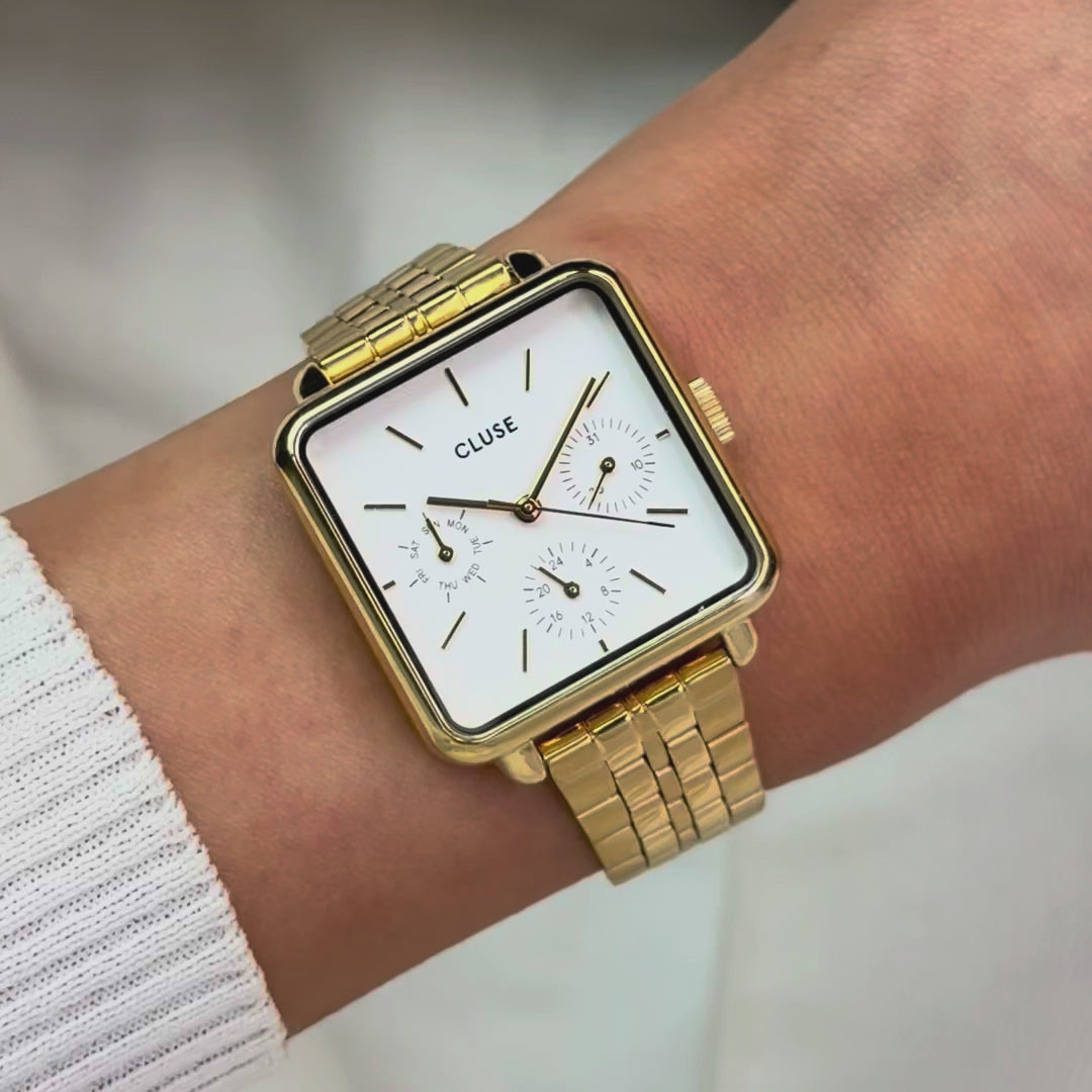 Produktvideo der goldfarbenen Cluse Damenuhr La Tetragone Multifunction CW13804 mit weißem Zifferblatt in quadratischem Uhrengehäuse an einem goldfarbenem Edelstahl-Armband